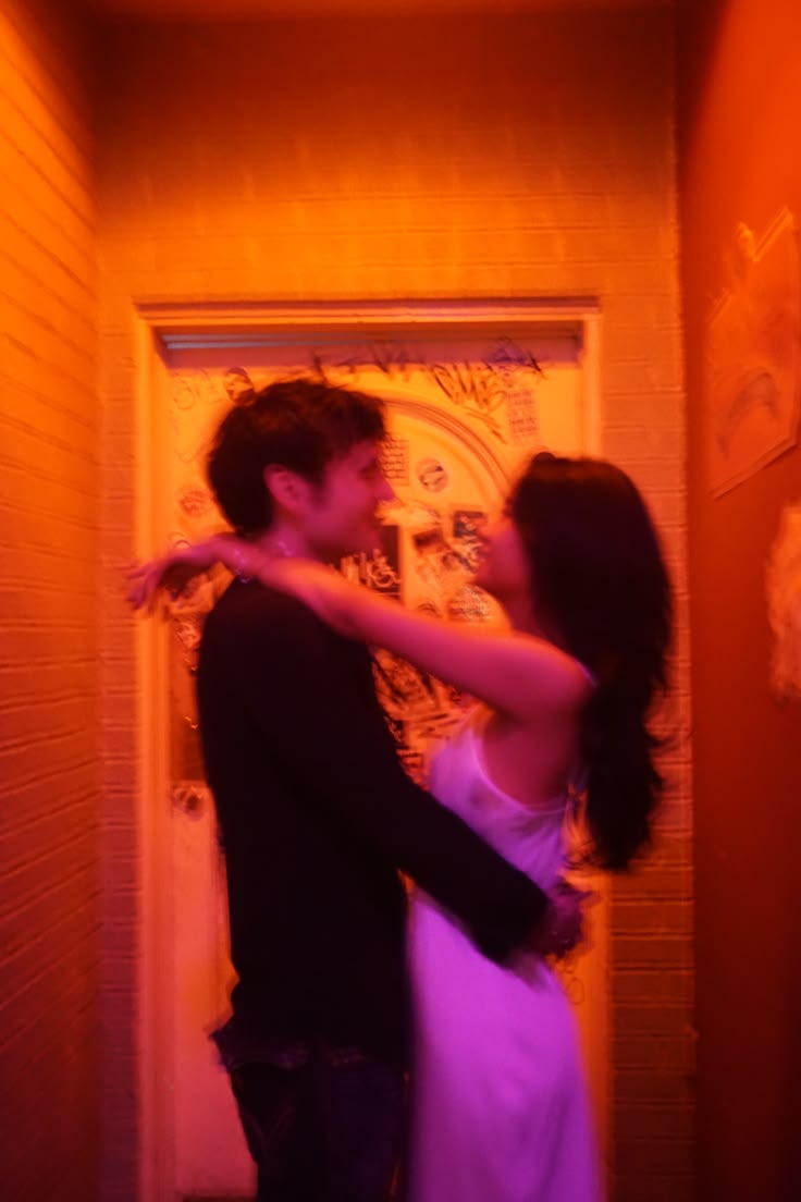 A happy couple hugging and smiling